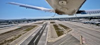 a view of an airplane landing at an airport